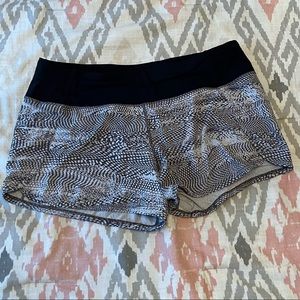 Gray and white Lululemon athletic shorts.